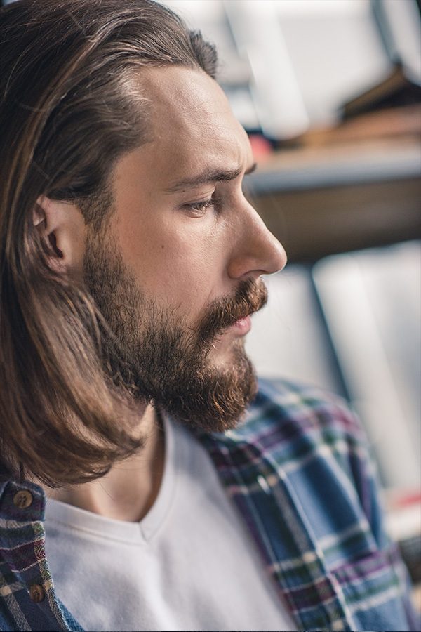 close-up-portrait-of-young-pensive-bearded-man-RJCGFCZ.jpg